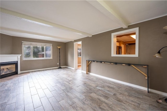 524 Saint Andrews Dr, Hempfield Twp Wml, PA 15601 - unfurnished living room with beam ceiling, wood finished floors, and a glass covered fireplace