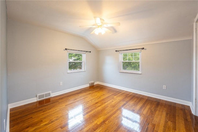 524 Saint Andrews Dr, Hempfield Twp Wml, PA 15601 - empty room featuring healthy amount of natural light, vaulted ceiling, ceiling fan, and wood finished floors