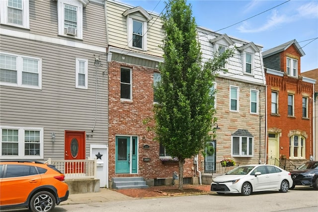 2315 Jane St, South Side, PA 15203 - townhome / multi-family property featuring entry steps, brick siding, and cooling unit