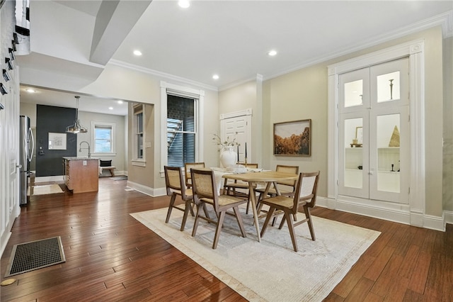 2315 Jane St, South Side, PA 15203 - dining room featuring dark wood-style flooring, crown molding, and recessed lighting