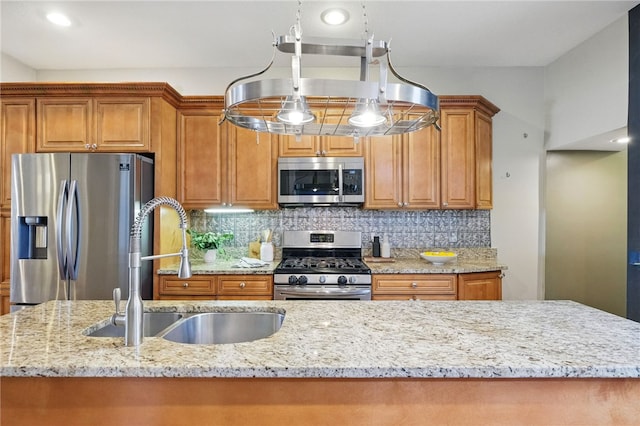 2315 Jane St, South Side, PA 15203 - kitchen with appliances with stainless steel finishes, light stone counters, brown cabinets, backsplash, and recessed lighting