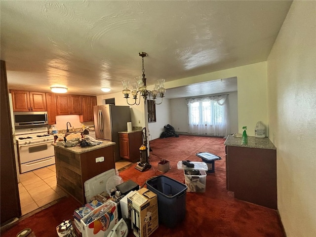 105 Fern Way, Glassport, PA 15045 - carpeted dining space with a sink and a chandelier