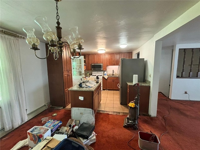 105 Fern Way, Glassport, PA 15045 - kitchen with appliances with stainless steel finishes, a kitchen island, light colored carpet, brown cabinets, and a chandelier