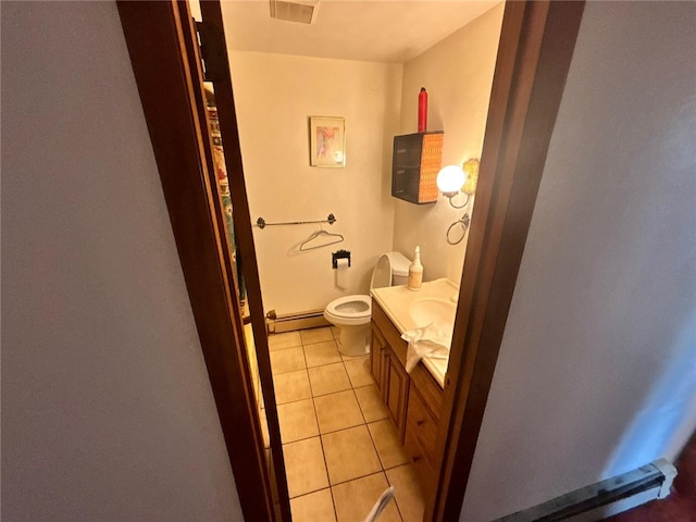 105 Fern Way, Glassport, PA 15045 - half bathroom with vanity, a baseboard radiator, and tile patterned flooring