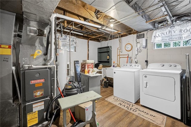 914 E Smithfield St, Elizabeth Twp/Boro, PA 15135 - laundry room featuring washer and dryer, gas water heater, wood finished floors, and heating unit