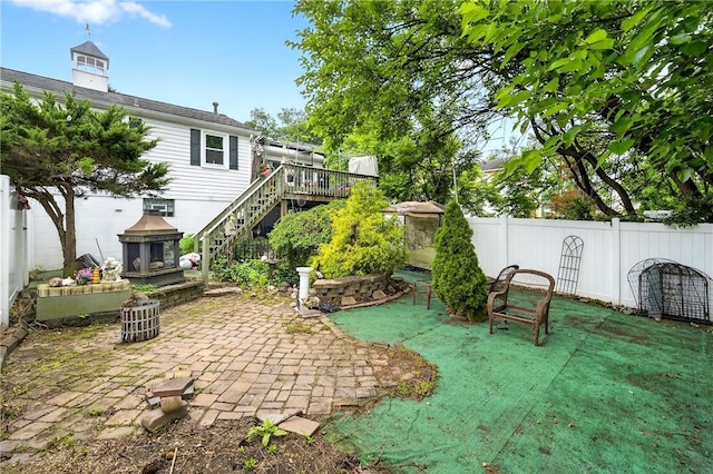 914 E Smithfield St, Elizabeth Twp/Boro, PA 15135 - fenced backyard featuring stairs, a deck, and a patio
