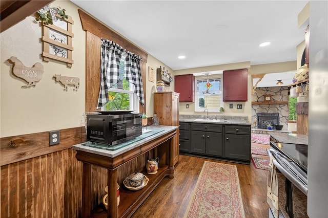 914 E Smithfield St, Elizabeth Twp/Boro, PA 15135 - kitchen with electric stove, light countertops, a fireplace, dark wood finished floors, and gray cabinetry