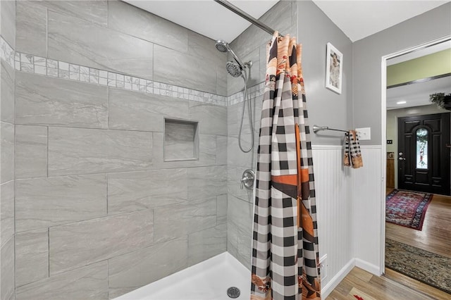 914 E Smithfield St, Elizabeth Twp/Boro, PA 15135 - full bath with wood finished floors, a tile shower, and a wainscoted wall