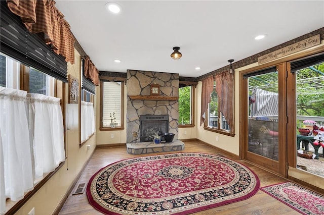 914 E Smithfield St, Elizabeth Twp/Boro, PA 15135 - living area featuring plenty of natural light, wood finished floors, a fireplace, and recessed lighting