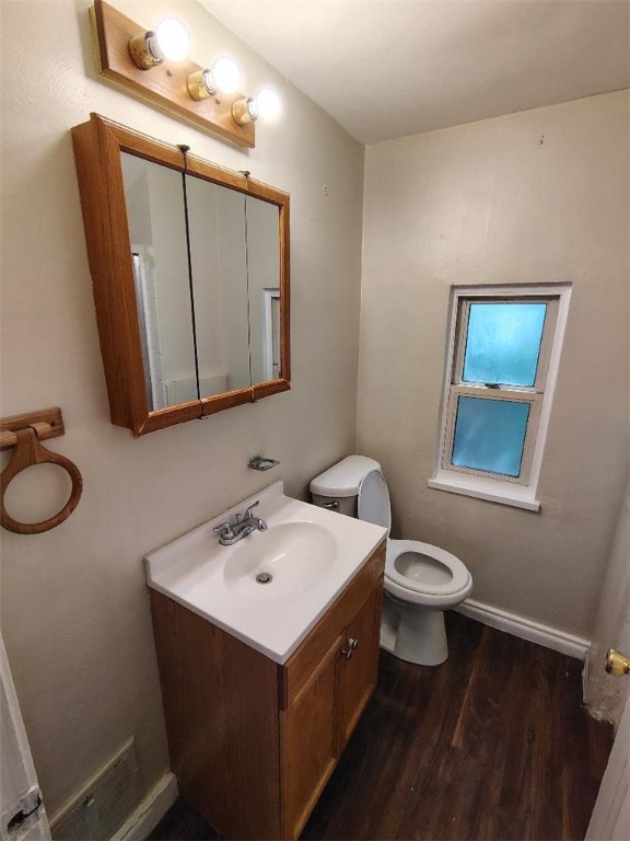 526 Pennwood Dr, Penn Hills, PA 15235 - half bathroom featuring vanity and wood finished floors