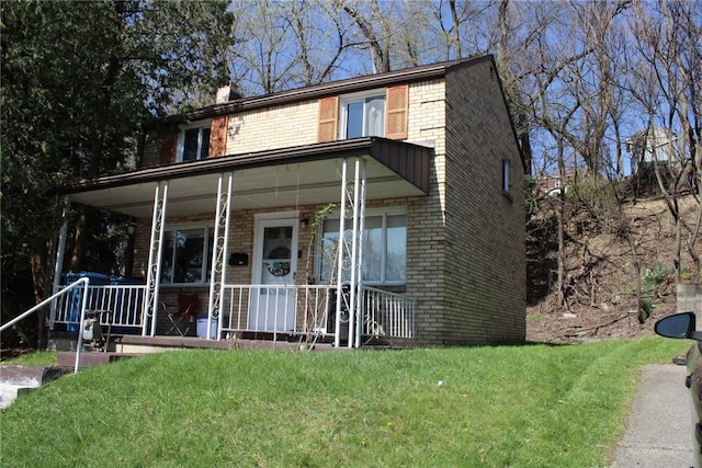 526 Pennwood Dr, Penn Hills, PA 15235 - view of front of house featuring brick siding, covered porch, a front yard, and a chimney