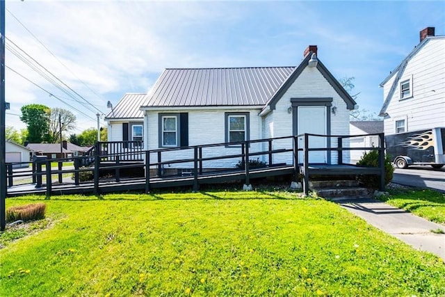 2201 Wilmington Rd, Neshannock Twp, PA 16105 - view of front of home with a front yard, a metal roof, a deck, and a chimney