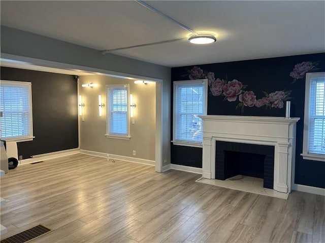 2201 Wilmington Rd, Neshannock Twp, PA 16105 - unfurnished living room with light wood finished floors and a fireplace with flush hearth