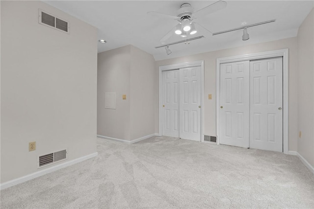 4 Pleasant Grove Dr, Patterson Heights, PA 15010 - unfurnished bedroom with rail lighting, multiple closets, carpet flooring, and a ceiling fan