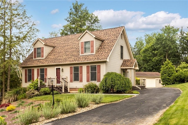 4 Pleasant Grove Dr, Patterson Heights, PA 15010 - cape cod home with an outdoor structure, roof with shingles, a detached garage, and a front lawn