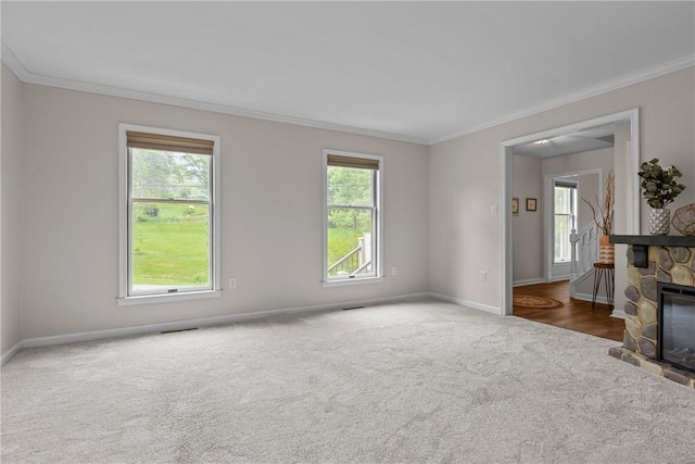 4 Pleasant Grove Dr, Patterson Heights, PA 15010 - unfurnished living room with carpet floors, crown molding, and a stone fireplace