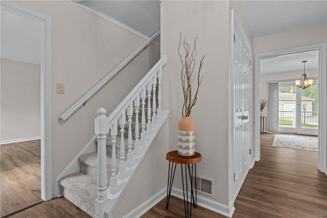 4 Pleasant Grove Dr, Patterson Heights, PA 15010 - stairway featuring wood finished floors and a chandelier