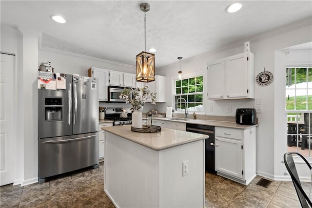 317 Shady Glen Dr, Moon/Crescent Twp, PA 15108 - kitchen with appliances with stainless steel finishes, white cabinets, plenty of natural light, light countertops, and crown molding