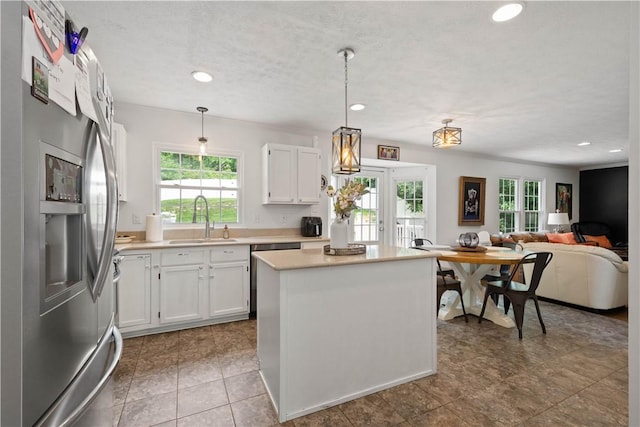 317 Shady Glen Dr, Moon/Crescent Twp, PA 15108 - kitchen featuring appliances with stainless steel finishes, healthy amount of natural light, white cabinets, and recessed lighting