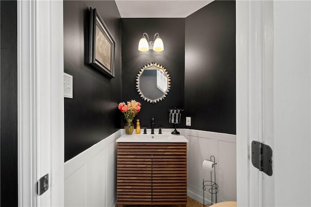 317 Shady Glen Dr, Moon/Crescent Twp, PA 15108 - half bathroom with wainscoting, a decorative wall, and vanity