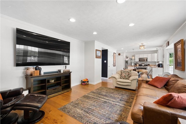 317 Shady Glen Dr, Moon/Crescent Twp, PA 15108 - living area featuring ornamental molding, recessed lighting, and light wood-type flooring