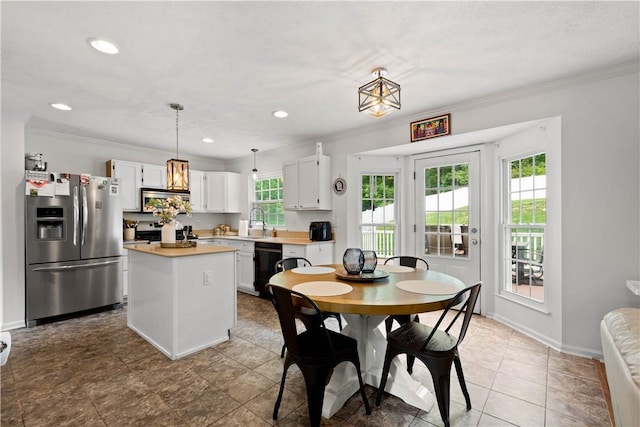 317 Shady Glen Dr, Moon/Crescent Twp, PA 15108 - dining room with healthy amount of natural light, crown molding, and recessed lighting