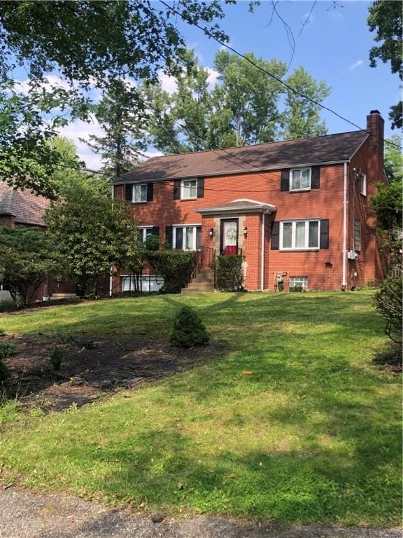 1850 Graham Blvd, Wilkinsburg, PA 15235 - view of front of house with a chimney and a front lawn