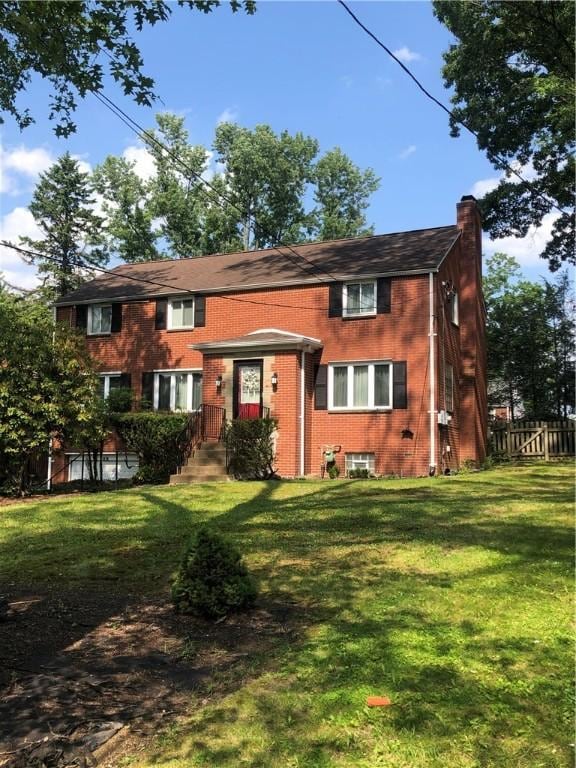 1850 Graham Blvd, Wilkinsburg, PA 15235 - view of front of house featuring a chimney and brick siding