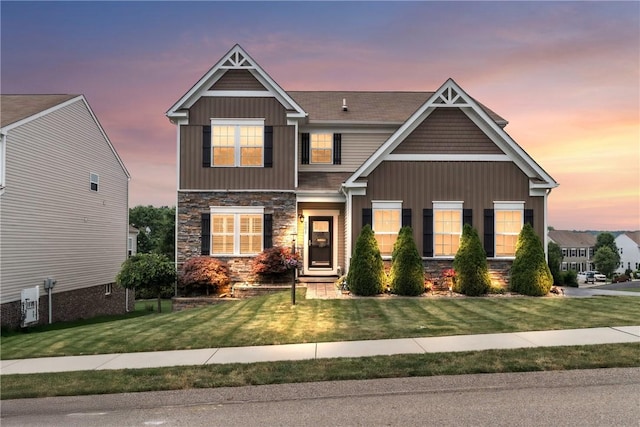 201 Millstream Ln, Zelienople Boro, PA 16063 - craftsman inspired home featuring stone siding, a yard, and board and batten siding