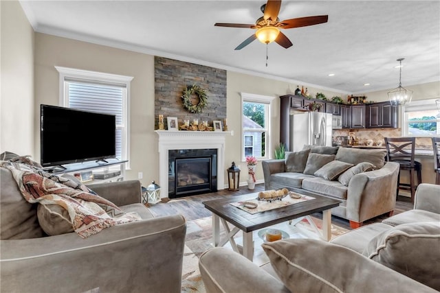 201 Millstream Ln, Zelienople Boro, PA 16063 - living room with plenty of natural light, light wood finished floors, ornamental molding, ceiling fan, and a fireplace