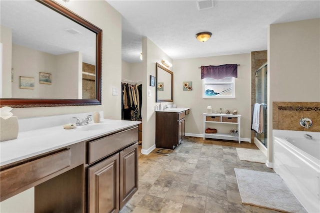 201 Millstream Ln, Zelienople Boro, PA 16063 - bathroom featuring two vanities, a garden tub, and a stall shower