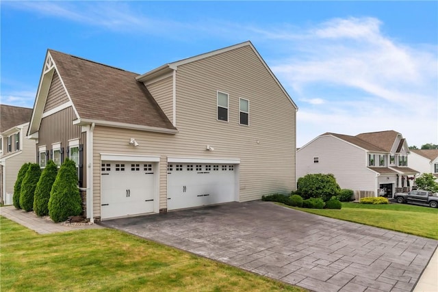 201 Millstream Ln, Zelienople Boro, PA 16063 - view of side of property featuring asphalt driveway, a yard, a garage, and roof with shingles