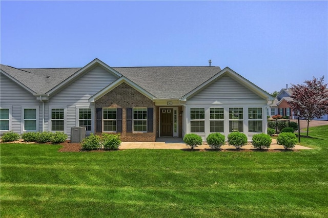705 Spring Valley Dr, Jackson Twp, PA 16063 - view of front of house featuring a shingled roof, a front yard, and brick siding
