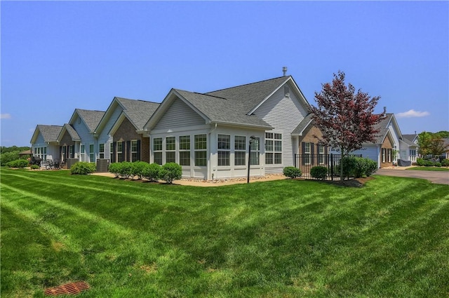 705 Spring Valley Dr, Jackson Twp, PA 16063 - rear view of house with a yard and a shingled roof