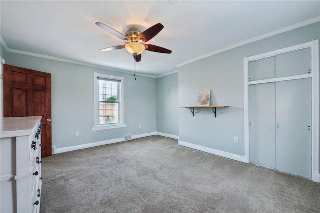 323 Fairmont St, Latrobe, PA 15650 - unfurnished bedroom featuring carpet, ornamental molding, a ceiling fan, and a closet