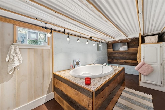 323 Fairmont St, Latrobe, PA 15650 - bathroom with wood walls and a tub