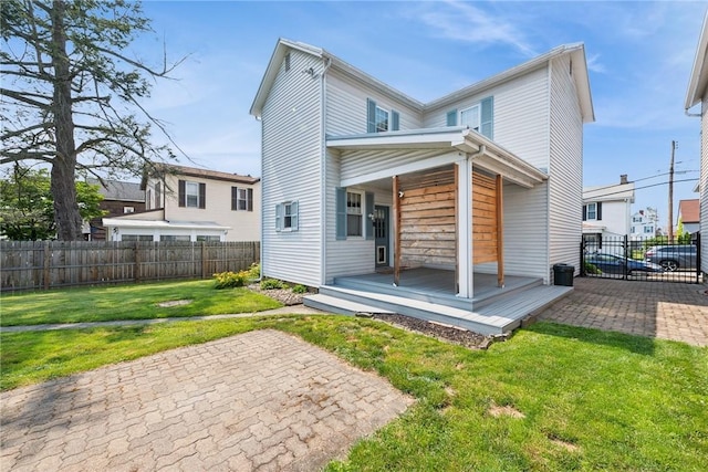 323 Fairmont St, Latrobe, PA 15650 - rear view of property with covered porch, a fenced backyard, and a patio