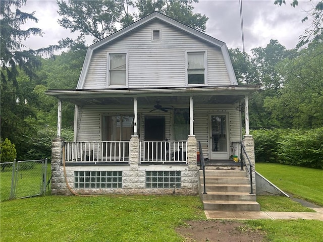 108 Leneake St, Wilkins Twp, PA 15145 - colonial inspired home featuring covered porch, a gambrel roof, a front yard, and a gate