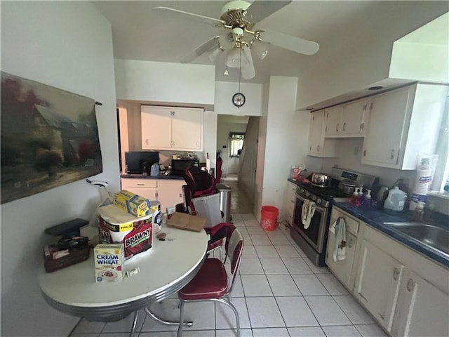 108 Leneake St, Wilkins Twp, PA 15145 - kitchen with stainless steel stove, a ceiling fan, light tile patterned flooring, and white cabinetry