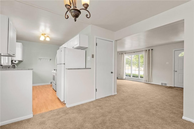 5311 Clearview Ave, Hopewell Twp Bea, PA 15001 - kitchen featuring light colored carpet, a chandelier, white appliances, white cabinetry, and light countertops