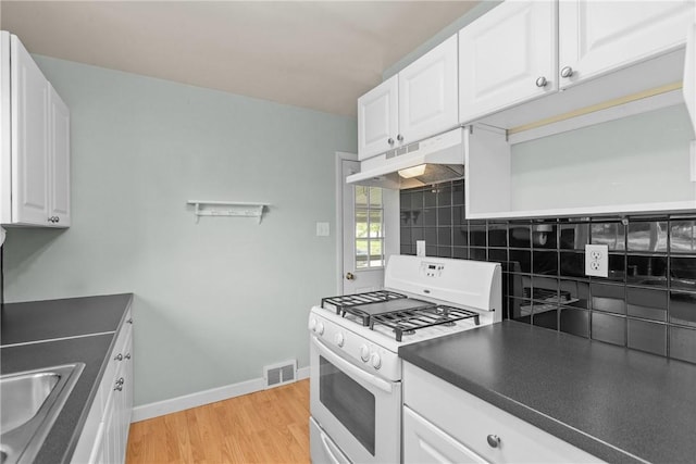 5311 Clearview Ave, Hopewell Twp Bea, PA 15001 - kitchen with white gas range, under cabinet range hood, light wood-type flooring, decorative backsplash, and white cabinets
