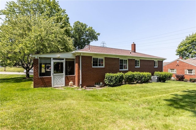 5311 Clearview Ave, Hopewell Twp Bea, PA 15001 - back of property featuring brick siding, a chimney, and a yard