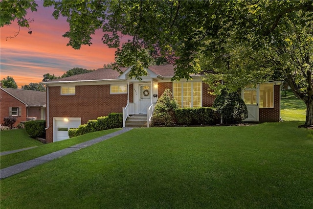 5311 Clearview Ave, Hopewell Twp Bea, PA 15001 - view of front of property featuring brick siding, a garage, and a front yard