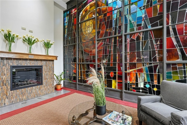 5 Bayard Rd Unit 113, Shadyside, PA 15213 - living area with a glass covered fireplace and a high ceiling