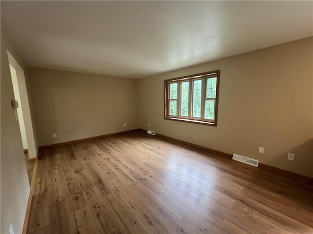 742 King St, Mckeesport, PA 15132 - spare room featuring wood finished floors and baseboards