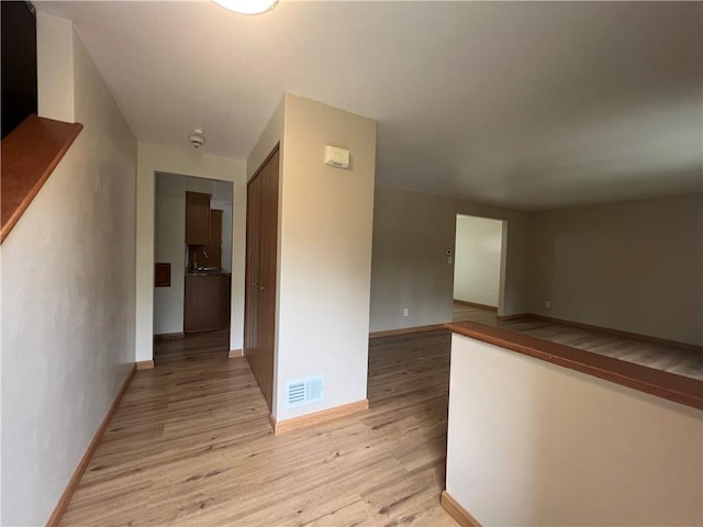 742 King St, Mckeesport, PA 15132 - hallway with light wood-type flooring and baseboards