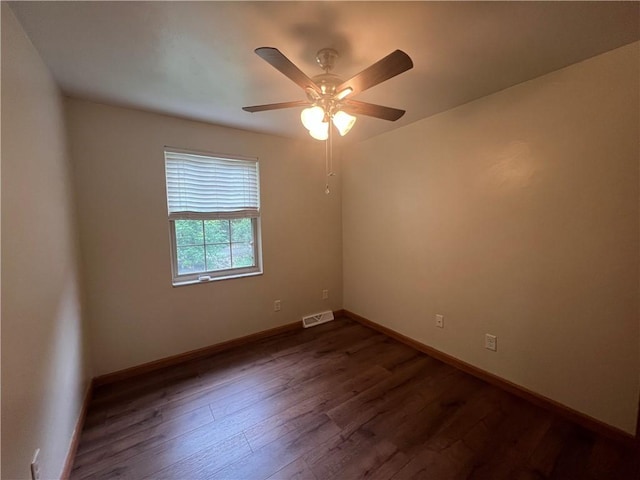 742 King St, Mckeesport, PA 15132 - empty room featuring dark wood-style floors and a ceiling fan