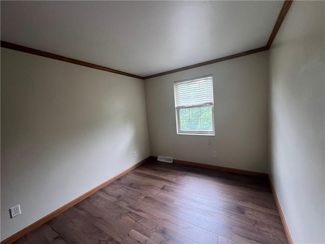 742 King St, Mckeesport, PA 15132 - unfurnished room featuring crown molding and dark wood-style floors