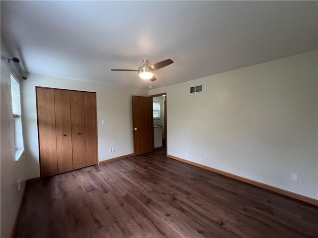 742 King St, Mckeesport, PA 15132 - unfurnished bedroom with wood finished floors, multiple windows, a closet, and a ceiling fan