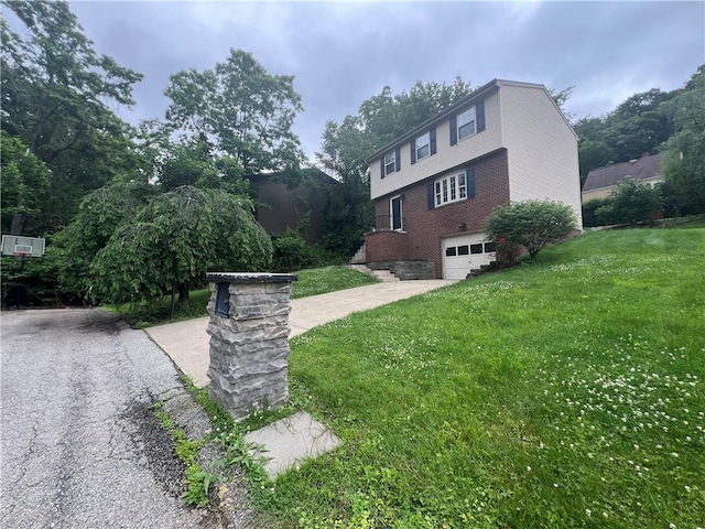 742 King St, Mckeesport, PA 15132 - view of side of property featuring an attached garage, brick siding, a lawn, and concrete driveway